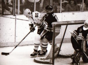 Mario Lemieux skiing with the puck